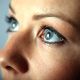 A close up of a young woman's blue eyes